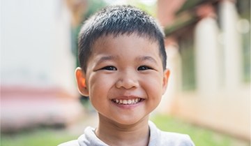 Young boy with healthy smile after children's dentistry