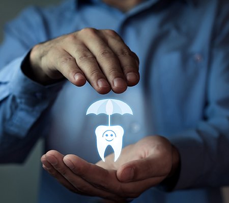 Molar under umbrella in man’s palms