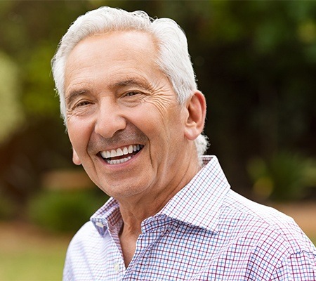 Older man with healthy smile thanks to the dentist in Bowie MD