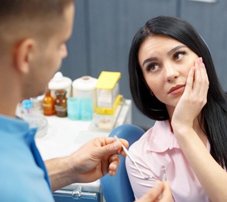 Woman with tooth pain in Bowie 