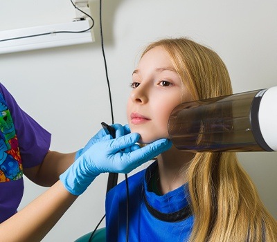 girl getting dental x-ray