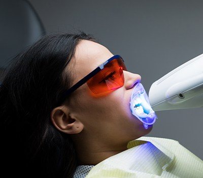 woman getting teeth whitening