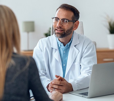 dentist explaining financing options to patient 