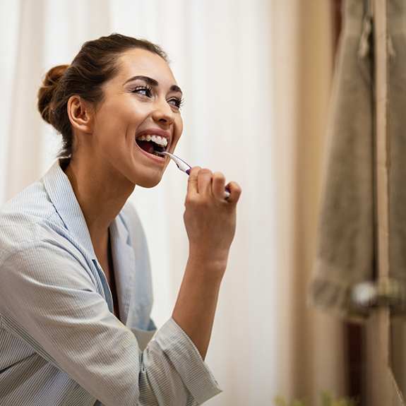 Woman brushing her teeth