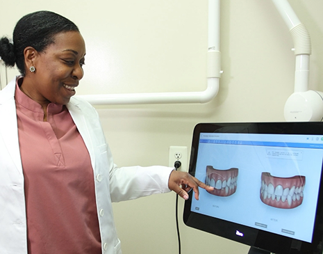 Dentist showing a patient a scan of their teeth