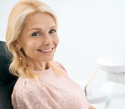 Woman smiling in the dental chair