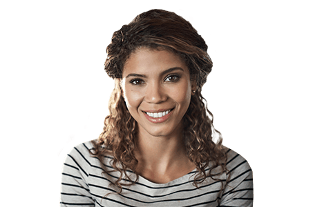 woman in striped shirt smiling after restorative dentistry