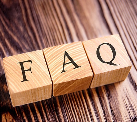 blocks that say FAQ sitting on a table 