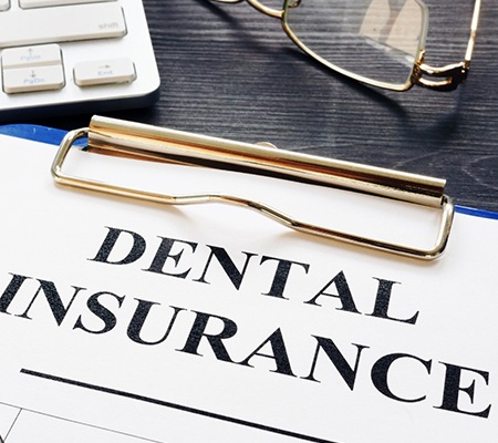 A dental insurance form resting on a table.