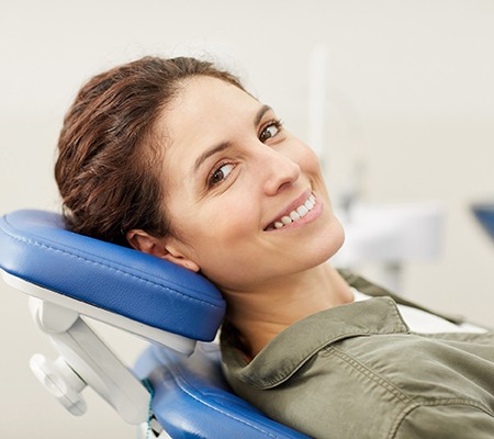 Smiling woman in dentist’s chair