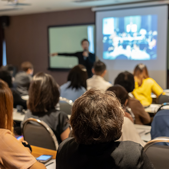 Lecturer presenting to a classroom