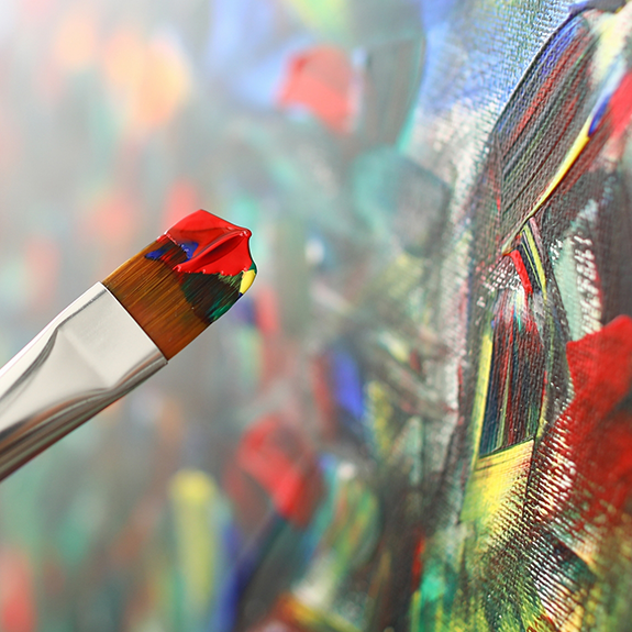 Close up of a paintbrush on canvas