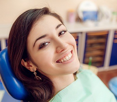 Woman smiling during dental checkup