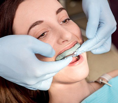 girl getting fluoride treatment