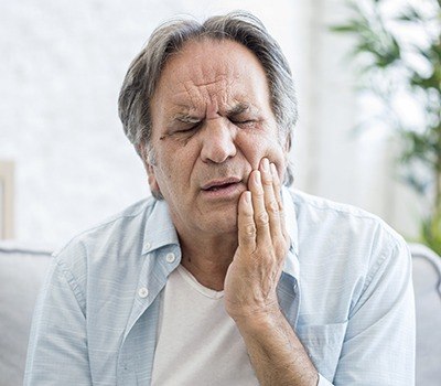 man with TMJ pain