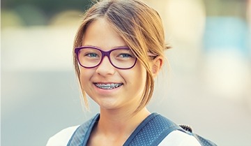 young girl with braces smiling