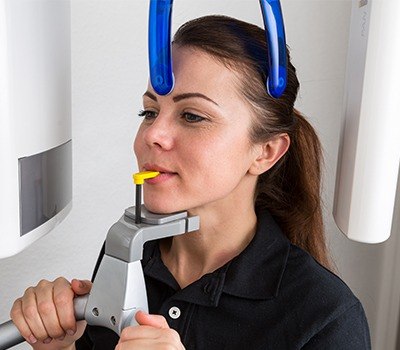 Woman receiving dental x-ray scan