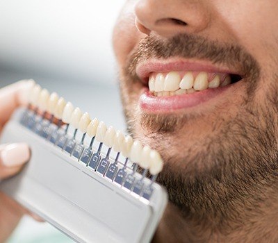 man at porcelain veneers consultation