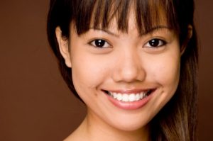 Young woman smiling after teeth whitening