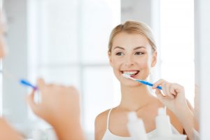 Woman brushing her teeth