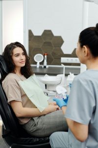 Dentist speaking with patient