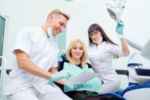 Female patient listening to the dentist discuss treatment